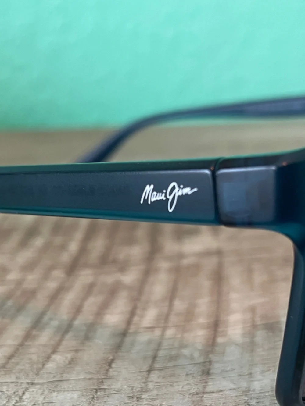 Maui Jim Black Frame Sunglasses with Blue Purple Mirrored Lenses